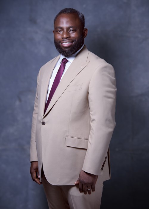 Headshot: beige suit, standing
